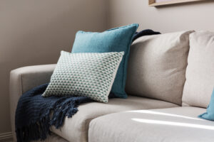 Close,Up,Of,A,Fabric,Sofa,With,Styled,Cushions,